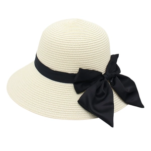 Elegant beige straw sun hat with black satin ribbon bow for women's beach vacations