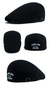 Detail view of the metal buckle and white CATALINA 1983 embroidery on the black cotton cap