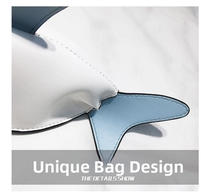 Detailed close-up of shark shaped bag with premium blue and white PU leather stitching