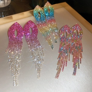 Macro shot of long gradient rhinestone tassel earrings in three vibrant color combinations