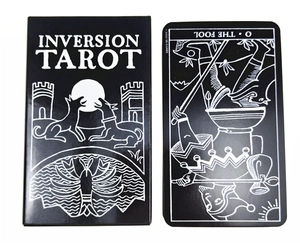 Macro shot of Inversion Tarot box and The Fool card in classic black and white style