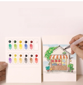 Detail of portable watercolor set with 12 colors, 8 cards, and water brush for painting