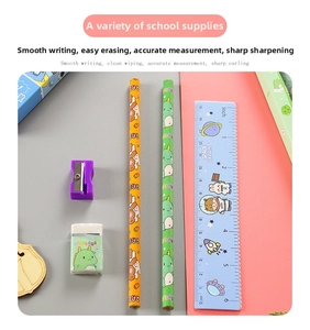 Close-up of school stationery set with cartoon pencils, eraser, sharpener, and ruler