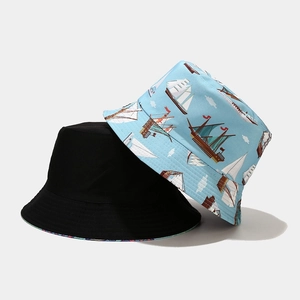 Dual-sided reversible sun hat with nautical sailboat print in black and light blue cotton