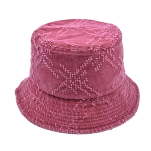 Close-up of wine red bucket hat with distressed frayed star embroidery and vintage texture