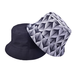 Detail of cotton canvas bucket hat showing fine stitching and leaf print pattern