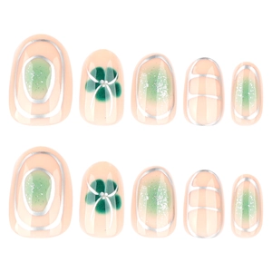 Almond-shaped press-on nails with green marble design and silver four-leaf clover patterns