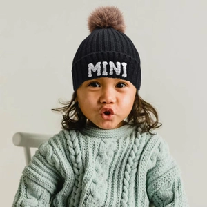 Kids black ribbed knit beanie with MINI embroidery and large faux fur pompom detail