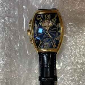 Men's automatic mechanical watch with gold tonneau case and blue textured dial