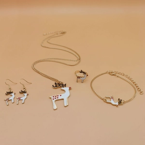 Detailed set of Christmas reindeer jewelry including necklace and earrings on beige background