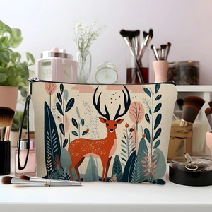 Canvas makeup bag featuring forest deer prints with a zipper closure and side strap