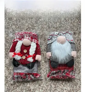 Detail of red and grey Christmas gnome seat covers in protective plastic packaging