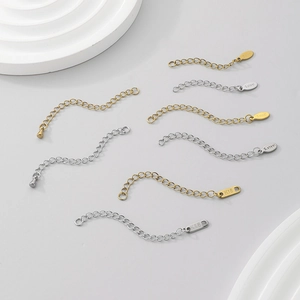 Macro shot of 18K gold and silver stainless steel extension chains with S.steel stamps