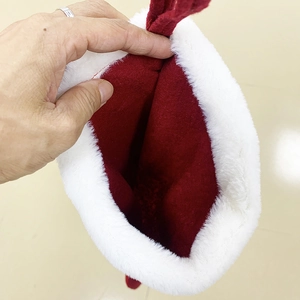 Large red Christmas stocking with white plush cuff and soft fabric interior detail