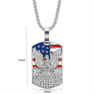 Macro shot of gold-plated eagle dog tag pendant with dimensions 51mm by 26mm
