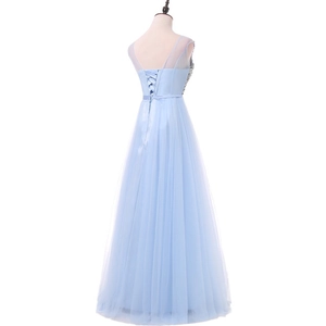 Detailed back view of light blue evening gown with corset lace-up and sheer tulle shoulders