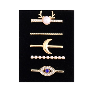 Detailed set of 5 golden decorative charms for silicone watch bands with pearls and blue gems