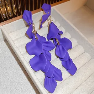 Elegant long purple rose petal tassel earrings with gold dangling chains on display