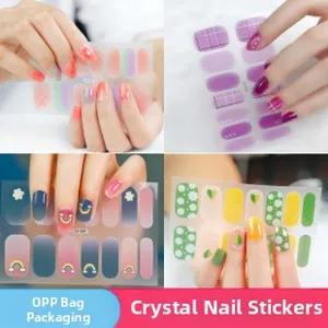 Close-up of assorted crystal nail stickers with heart, grid, and floral designs
