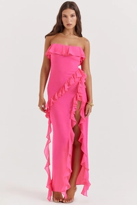 Vue détaillée de la robe longue rose fuchsia bustier avec volants et fente latérale haute