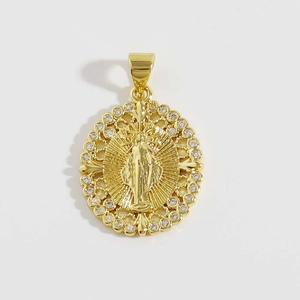 Macro detail of 18K gold plated oval religious pendant with micro-pave zircon crystals