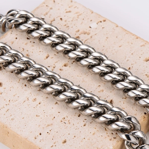 Silver stainless steel Cuban link necklace with diamond-set lion buckle on stone