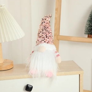 Pink sequin Christmas gnome with white beard and warm glowing light for home decoration