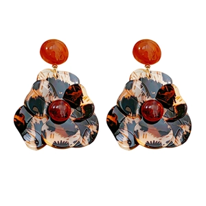 Elegant resin flower earrings with leopard print and amber finish on white background