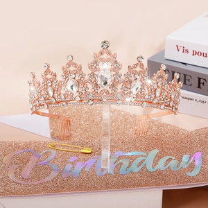 Detailed shot of rose gold rhinestone birthday crown and pink glitter sash set