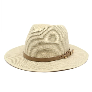 Panama straw hat in beige with brown leather band and gold buckle on white background