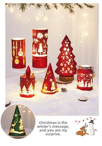 Close-up of hollowed-out Christmas glass lanterns with reindeer and snowflake patterns