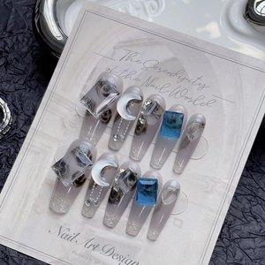 Icy blueberry gradient press-on nails with luxury gems and silver moon charms