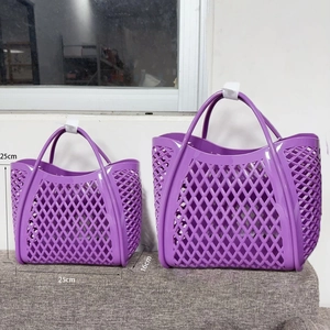 Macro detail of purple hollowed-out PVC storage basket with sizing dimensions and handles