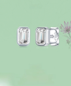 Detailed close-up of S925 sterling silver stud earrings with emerald-cut cubic zirconia