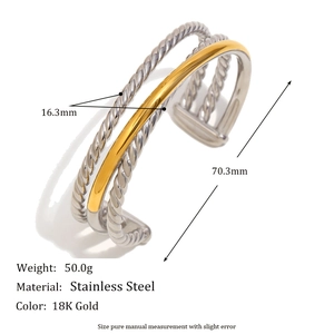 Detail view of multi-layer stainless steel bangle showing 18K gold and silver textures