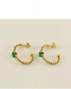 Detail of 18K gold plated earrings featuring green gemstone and lead-free material