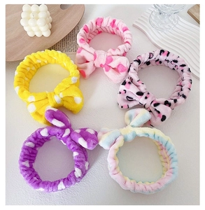 Detailed view of various patterns including leopard and dots on plush coral fleece headbands