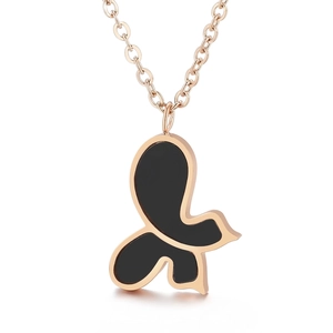 Elegant rose gold butterfly necklace with asymmetric black shell pendant on an O-chain