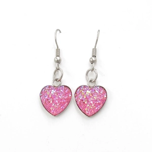 Detail of heart earrings with pink glitter inlay and silver stainless steel hooks