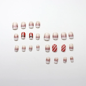 Christmas press-on nails with 24 pieces featuring red stripes and Santa glitter designs