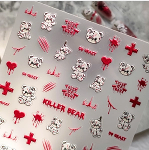 Close-up of Halloween killer bear nail stickers with bloody hearts and red cross designs