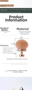 Macro detail of large mushroom head powder brush with rose gold handle and synthetic bristles