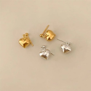 Minimalist 925 sterling silver heart stud earrings in polished gold and silver finishes
