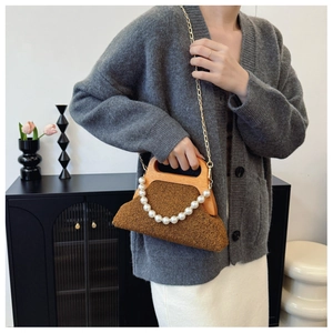 Brown teddy faux fur evening bag with wooden handle and elegant pearl chain detail