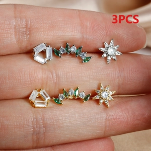 Detailed macro view of 3PCS gold and silver star and geometric stud earrings set
