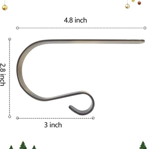 Antique bronze Christmas stocking mantel hook with dimensional scale of 4.8 x 2.8 inches