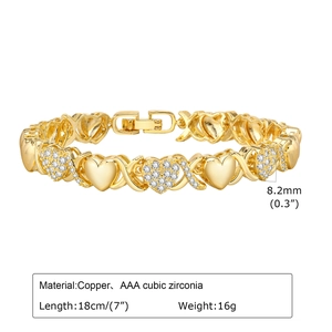 Detailed view of copper XO heart bracelet with AAA cubic zirconia and gold finish