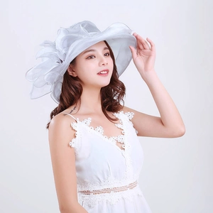 Detail of elegant grey organza sun hat featuring multi-layered floral ruffle decoration