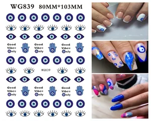 Detailed blue evil eye and hamsa hand nail art stickers with various decorative patterns