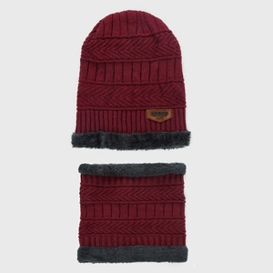 Detail of dark red knit hat and neck warmer with thick faux fur lining and leather patch